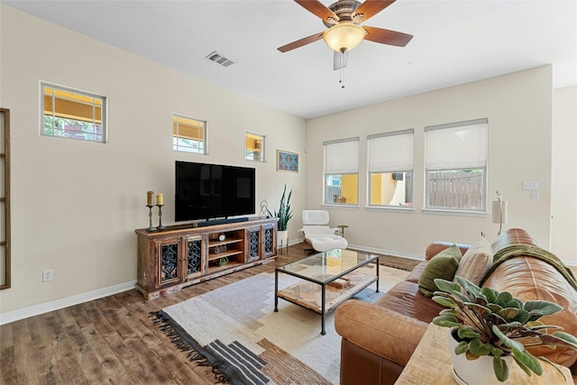 living room with hardwood / wood-style flooring and ceiling fan