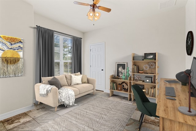 office featuring baseboards, visible vents, and a ceiling fan