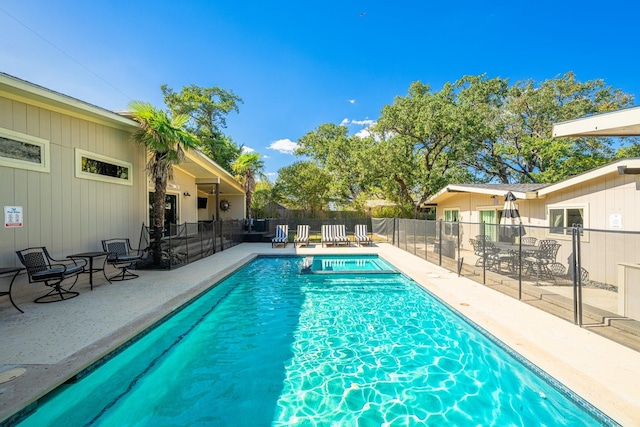 view of pool featuring a patio area