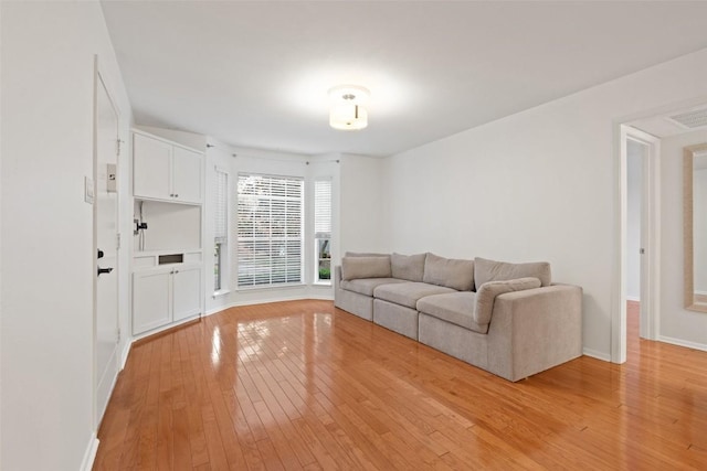 unfurnished living room featuring light wood-type flooring