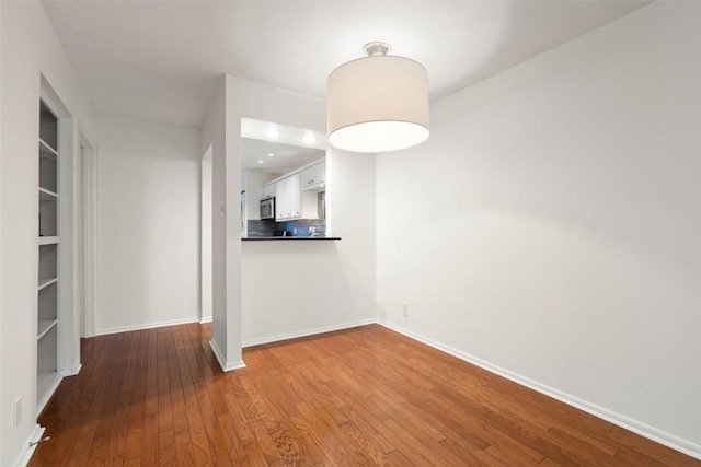 unfurnished dining area featuring light hardwood / wood-style flooring