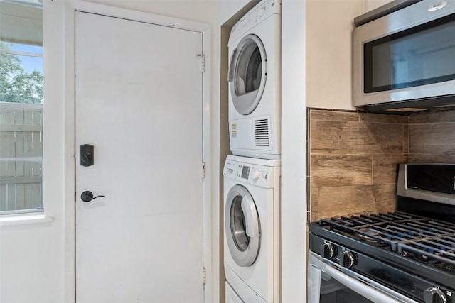 laundry room with stacked washer and clothes dryer