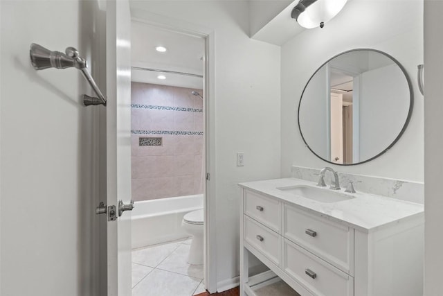 full bathroom with tile patterned floors, vanity, toilet, and tiled shower / bath