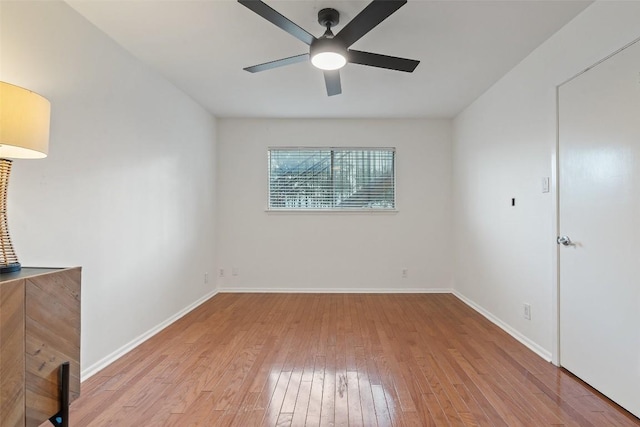 spare room featuring ceiling fan and light wood-type flooring