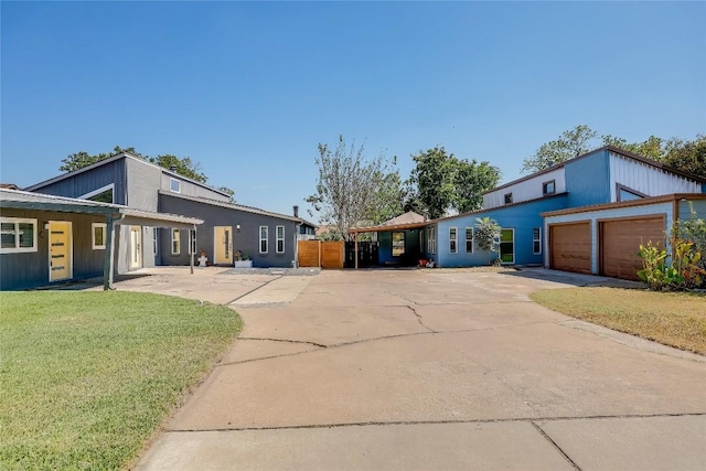 view of front of home with a garage and a front yard