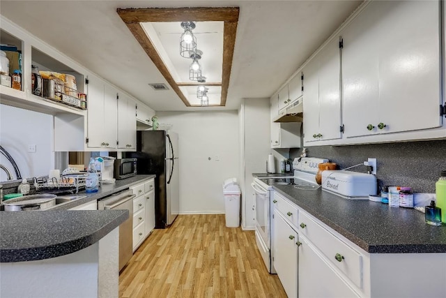 1807 Briar Hill Dr Unit A & B, Austin, TX 78741 - kitchen with stainless steel appliances, white cabinets, light wood-style floors, and dark countertops