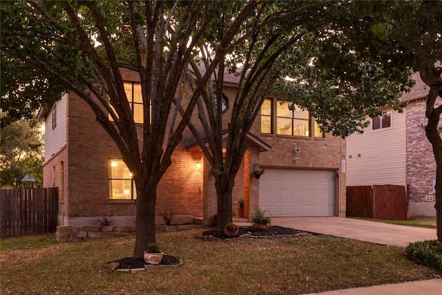 view of front of property featuring a garage and a front yard