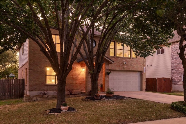 view of front facade featuring concrete driveway, brick siding, an attached garage, and fence