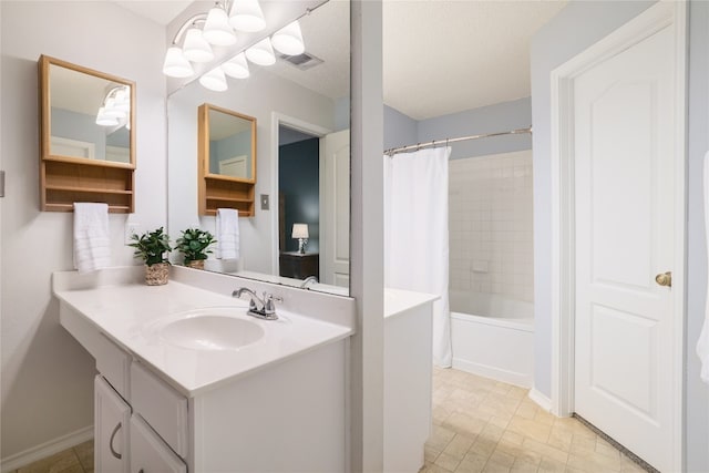 bathroom with vanity and shower / bath combo