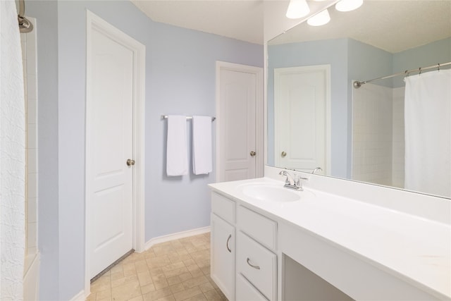 bathroom with vanity and a shower with shower curtain