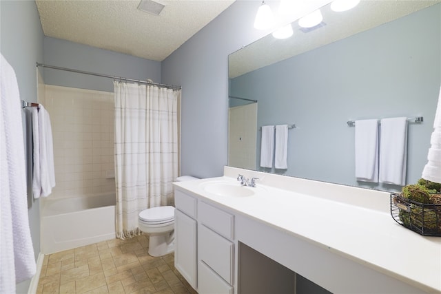 full bathroom featuring a textured ceiling, vanity, shower / bath combo with shower curtain, and toilet