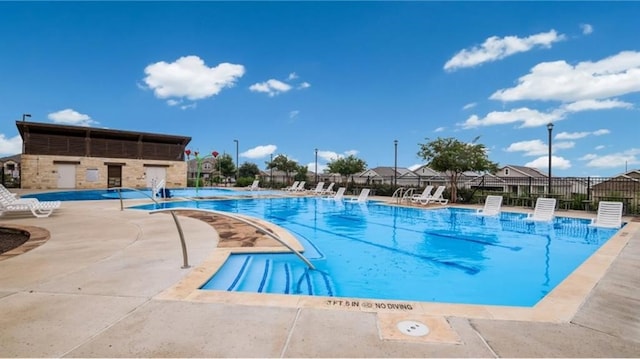 view of swimming pool featuring a patio area