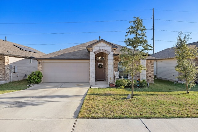 ranch-style home with a front lawn and a garage