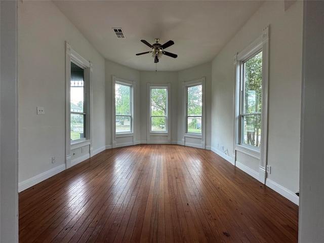 empty room featuring ceiling fan and dark hardwood / wood-style floors