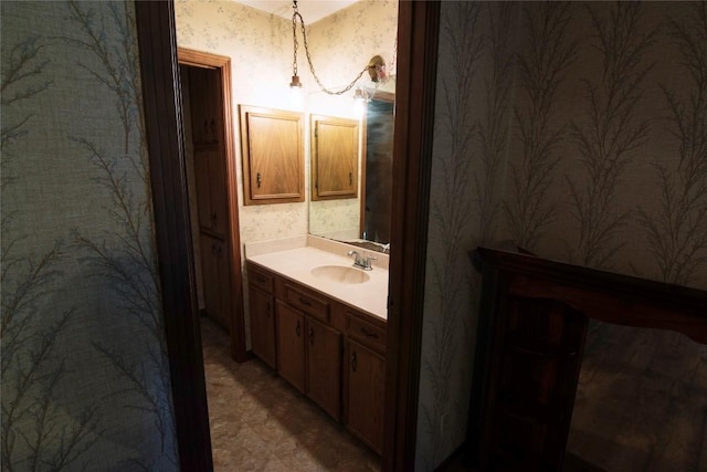 209 Simpson St, Schulenburg, TX 78956 - bathroom featuring wallpapered walls and vanity