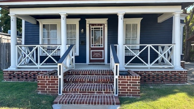 entrance to property with a porch