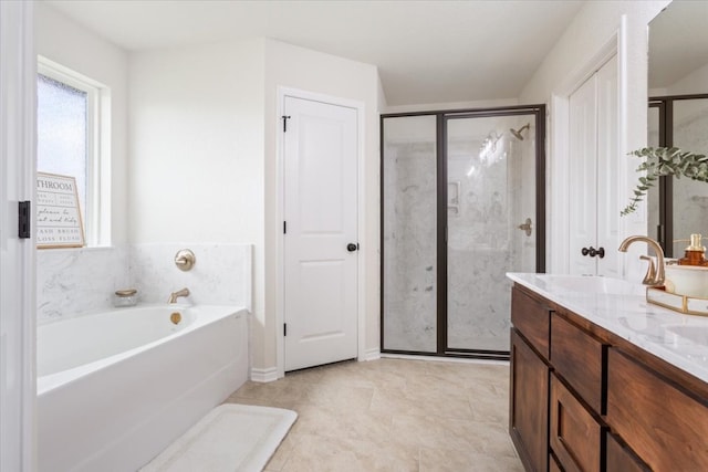 bathroom with shower with separate bathtub, tile patterned floors, and vanity