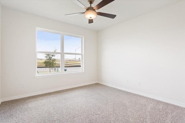 spare room with carpet and ceiling fan