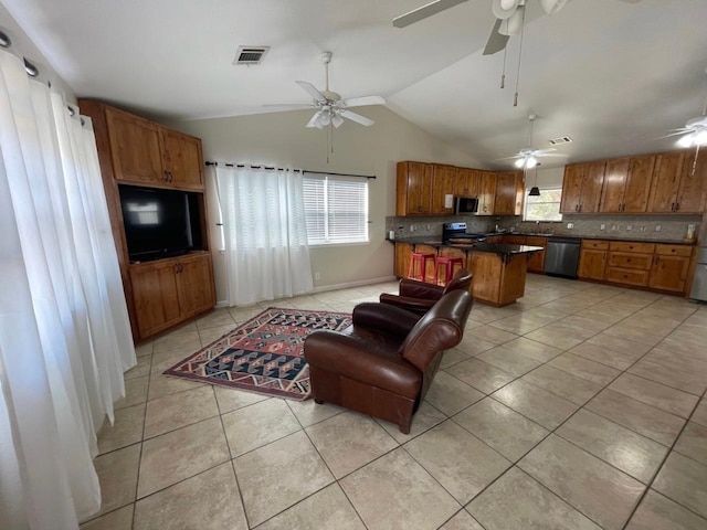 tiled living room featuring high vaulted ceiling, ceiling fan, and sink