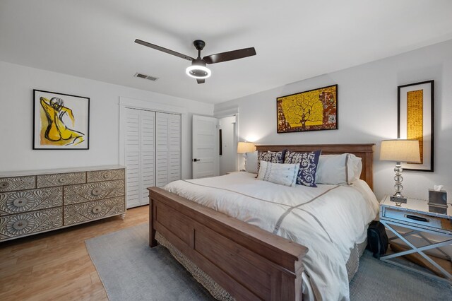 bedroom featuring a closet, ceiling fan, and hardwood / wood-style floors