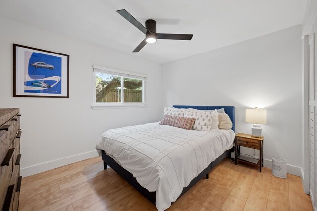 bedroom featuring light hardwood / wood-style floors and ceiling fan