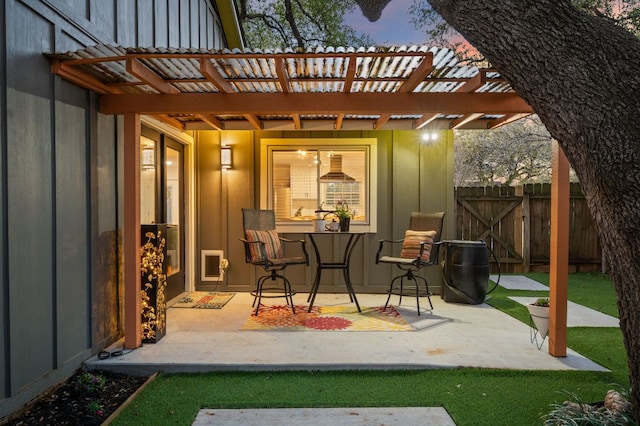 view of patio / terrace with a gate, fence, and a pergola