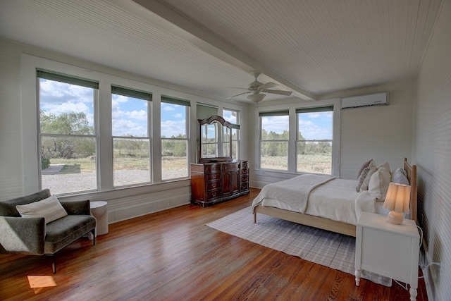 bedroom with ceiling fan, a wall mounted AC, beam ceiling, and wood-type flooring