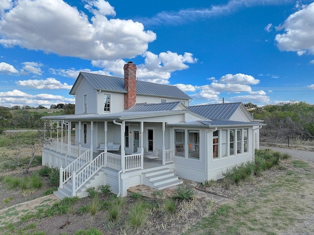 back of house with a porch