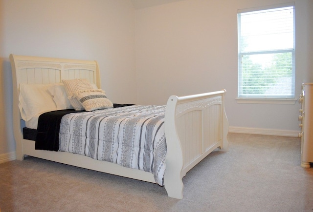 bedroom with light colored carpet