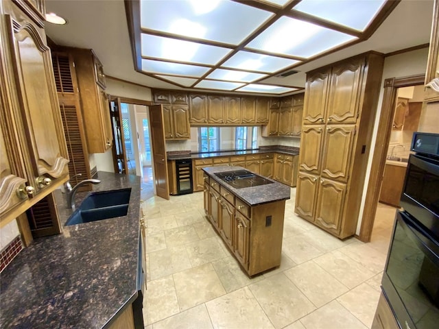 kitchen with wine cooler, black appliances, a center island, dark stone counters, and sink