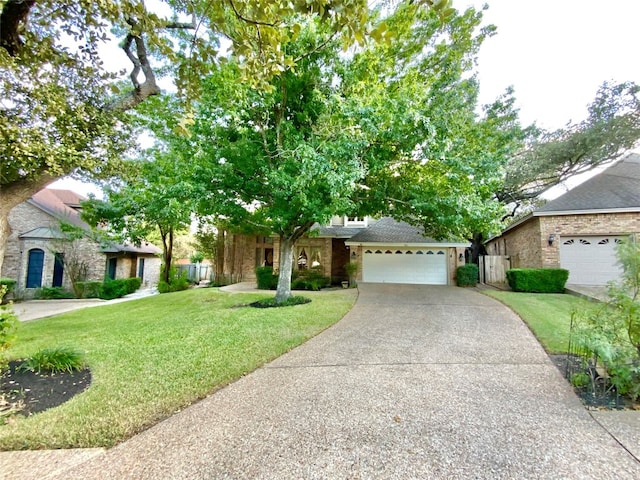 view of front of house with a front yard and a garage