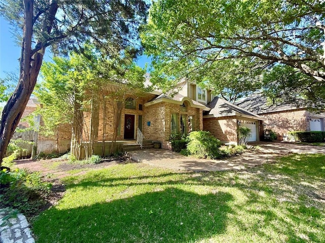 7011 Quill Leaf Cv, Austin, TX 78750 - view of front of house with a garage, brick siding, and driveway