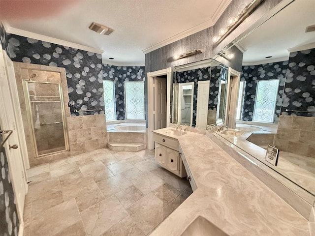 7011 Quill Leaf Cv, Austin, TX 78750 - bathroom featuring crown molding, a bath, vanity, a shower stall, and wallpapered walls