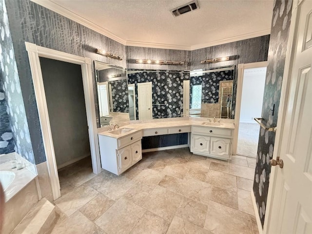 7011 Quill Leaf Cv, Austin, TX 78750 - full bathroom with double vanity, a bath, a textured ceiling, ornamental molding, and stone finish floors