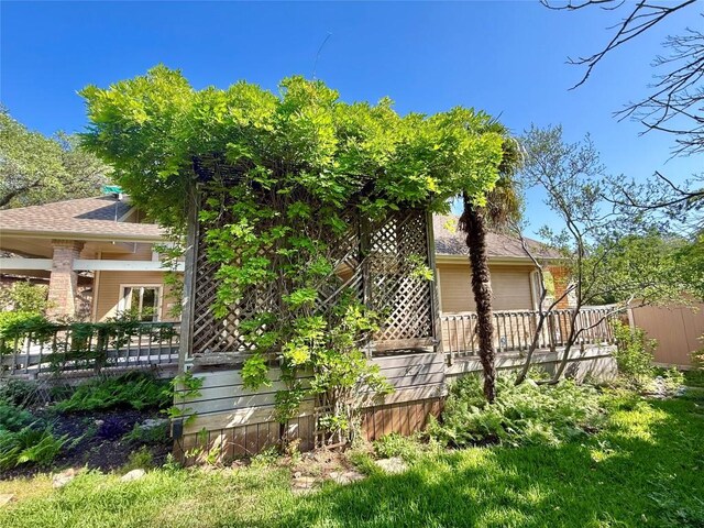 7011 Quill Leaf Cv, Austin, TX 78750 - rear view of house with a deck and an attached garage