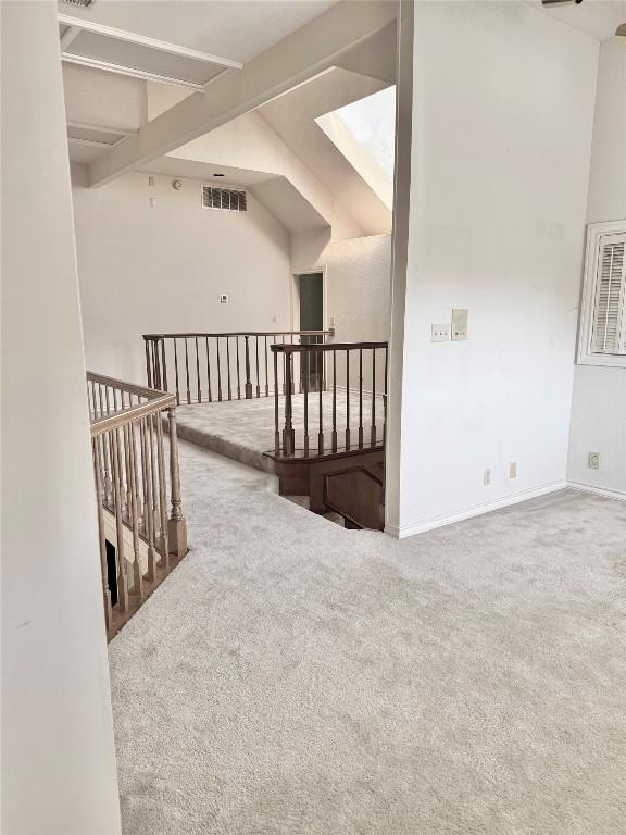 7011 Quill Leaf Cv, Austin, TX 78750 - hallway featuring an upstairs landing, carpet, and beam ceiling