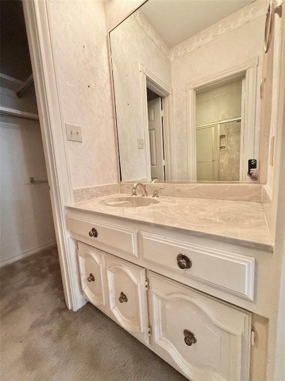 7011 Quill Leaf Cv, Austin, TX 78750 - bathroom featuring vanity and a shower with door