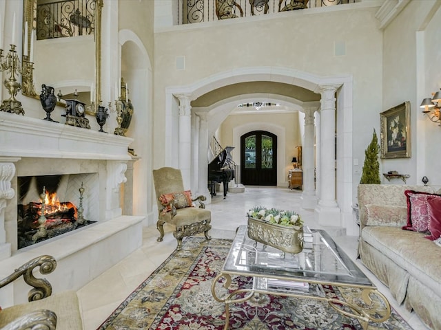 4406 Silent Trl, Austin, TX 78746 - interior space featuring arched walkways, a towering ceiling, french doors, ornate columns, and a high end fireplace