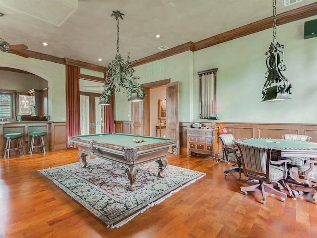 playroom featuring wood-type flooring, ornamental molding, and billiards