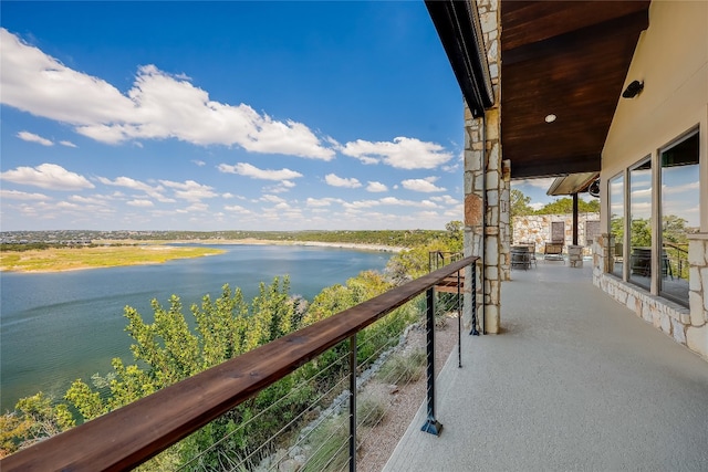 balcony featuring a water view