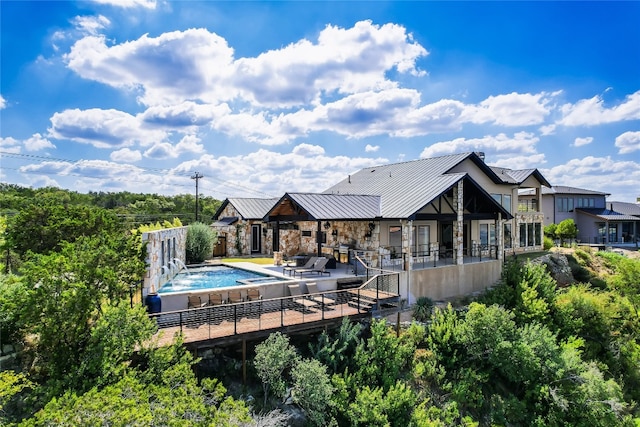 view of pool featuring a patio and pool water feature