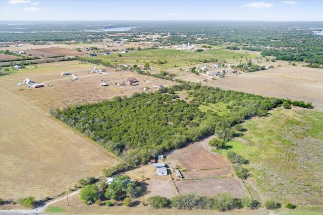 birds eye view of property with a rural view