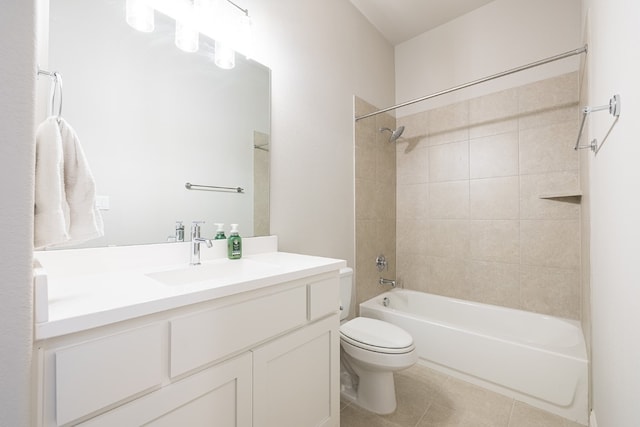 full bathroom with toilet, vanity, and tiled shower / bath