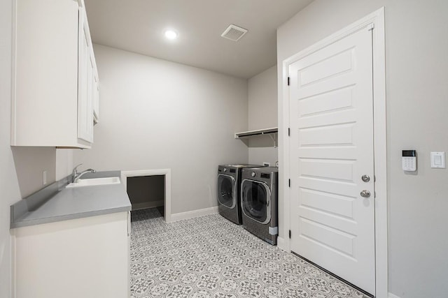 105 Bull Ridge Trl, Georgetown, TX 78628 - laundry room featuring independent washer and dryer, cabinet space, and baseboards