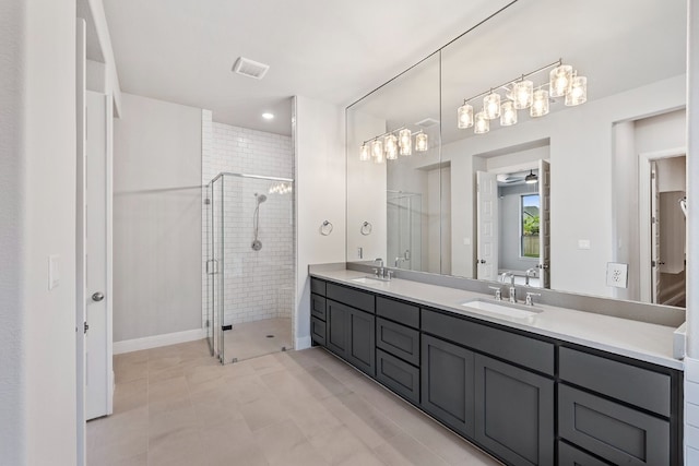 bathroom featuring ceiling fan, walk in shower, tile patterned floors, and vanity