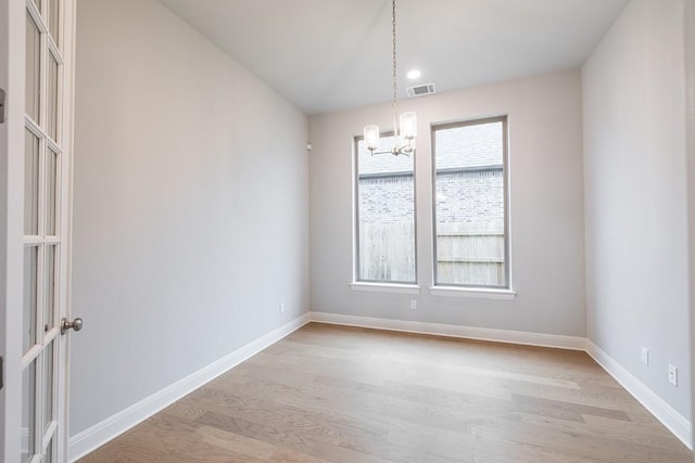 105 Bull Ridge Trl, Georgetown, TX 78628 - spare room with a chandelier, light wood-type flooring, baseboards, and recessed lighting