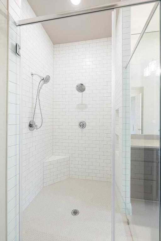 105 Bull Ridge Trl, Georgetown, TX 78628 - bathroom featuring a stall shower