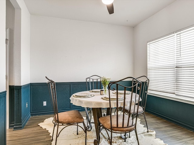 dining room featuring wood-type flooring and ceiling fan