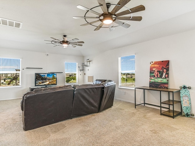 carpeted living room featuring ceiling fan