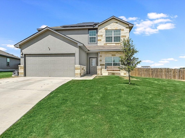 traditional-style house featuring solar panels, driveway, stone siding, fence, and a front yard
